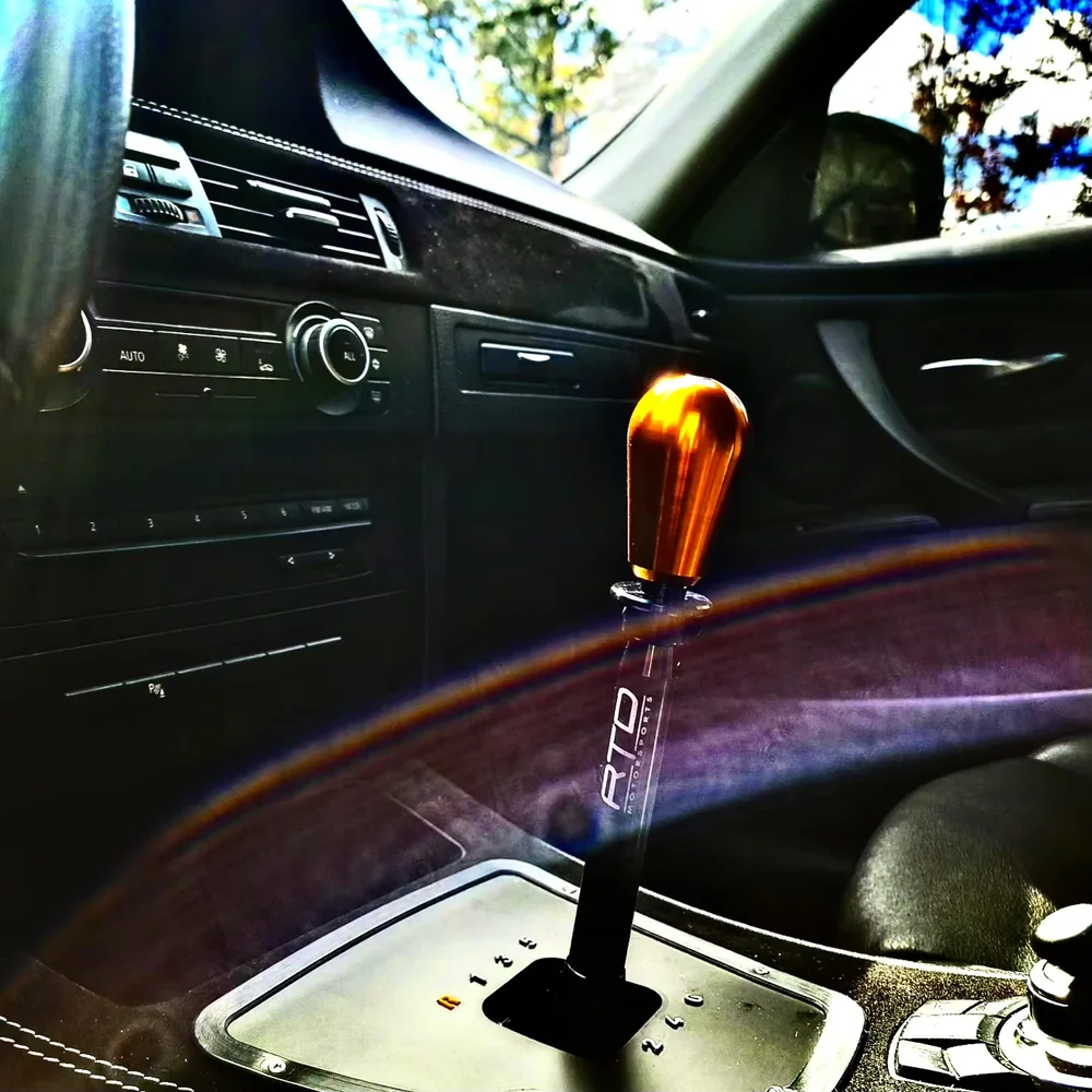 Close-up of a manual transmission shift lever inside a vehicle